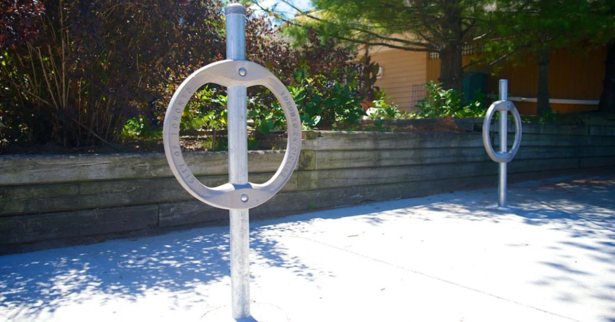 Bike lock rings on a city sidewalk